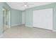 Bedroom with sliding glass doors and double door closet at 217 Rotonda Cir, Rotonda West, FL 33947