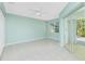 Bedroom with sliding glass doors, tile floors and ceiling fan at 217 Rotonda Cir, Rotonda West, FL 33947