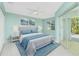 Bedroom with patio access and light blue decor at 217 Rotonda Cir, Rotonda West, FL 33947