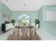 Dining area with large window and seating for six at 217 Rotonda Cir, Rotonda West, FL 33947