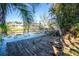 Rustic wooden dock offers peaceful water views at 217 Rotonda Cir, Rotonda West, FL 33947
