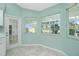 Modern kitchen with white cabinets, stainless steel appliances, and tile floors at 217 Rotonda Cir, Rotonda West, FL 33947