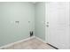 Laundry room with tile floor, hookups, and a door at 217 Rotonda Cir, Rotonda West, FL 33947