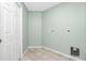 Laundry room with tile floors and a door to outside at 217 Rotonda Cir, Rotonda West, FL 33947