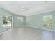 Bright and airy living room with tile floors and sliding glass doors at 217 Rotonda Cir, Rotonda West, FL 33947