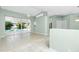Living room with sliding glass doors to a pool and neutral walls at 217 Rotonda Cir, Rotonda West, FL 33947