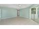 Large living room with tile floors and access to outdoor space at 217 Rotonda Cir, Rotonda West, FL 33947