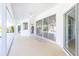 Bright, spacious covered patio with access to the pool and kitchen at 217 Rotonda Cir, Rotonda West, FL 33947
