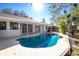 Relaxing kidney-shaped pool with ample patio space at 217 Rotonda Cir, Rotonda West, FL 33947