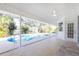 Covered patio with pool access and view of tranquil water at 217 Rotonda Cir, Rotonda West, FL 33947
