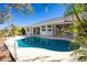 Inviting kidney-shaped pool with expansive patio and water views at 217 Rotonda Cir, Rotonda West, FL 33947