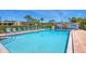 Refreshing community pool with ample lounge chairs at 23 Quails Run Blvd # 2, Englewood, FL 34223