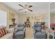 Relaxing living room with comfortable seating and a ceiling fan at 23 Quails Run Blvd # 2, Englewood, FL 34223