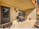 Front porch with seating area and entrance to condo unit at 23 Quails Run Blvd # 2, Englewood, FL 34223