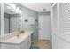 Another shot of the bathroom, highlighting the sink, mirror, toilet and closet at 404 Pine Hollow Cir # 404, Englewood, FL 34223