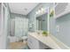 Bathroom with a tub, shower, toilet and sink at 404 Pine Hollow Cir # 404, Englewood, FL 34223