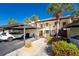 Condo complex with carport and well maintained landscaping at 404 Pine Hollow Cir # 404, Englewood, FL 34223