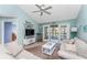 Living area featuring bright, natural light, ceiling fan and french doors leading to outdoor space at 404 Pine Hollow Cir # 404, Englewood, FL 34223