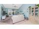 Cozy living room with a ceiling fan and access to the lanai through sliding glass doors at 404 Pine Hollow Cir # 404, Englewood, FL 34223