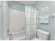Close up of a shower, tub, toilet and decorative towel in the bathroom at 404 Pine Hollow Cir # 404, Englewood, FL 34223