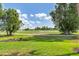 Scenic view of a lush golf course at 4663 Arlington Dr, Placida, FL 33946