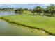 Golf course green next to water at 4663 Arlington Dr, Placida, FL 33946