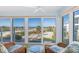 Sunroom boasts stunning ocean views and comfy seating at 5000 Gasparilla Rd # Dc206, Boca Grande, FL 33921