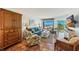 Relax in this bright living room with access to beach views, beautiful furnishings, and unique flooring at 5000 Gasparilla Rd # Dc206, Boca Grande, FL 33921