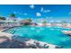 Inviting resort-style pool with a tiki bar and ample lounge chairs at 5000 Gasparilla Rd # Dc206, Boca Grande, FL 33921