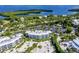 Aerial view of waterfront community with lush landscaping and resort-style amenities at 5000 Gasparilla Rd # Dc206, Boca Grande, FL 33921