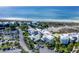 Aerial view of beachfront condos with parking and lush landscaping at 5000 Gasparilla Rd # Dc206, Boca Grande, FL 33921