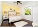 Charming bedroom with yellow walls and wood floors at 65 Par View Ter, Rotonda West, FL 33947