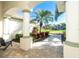 Brick walkway leading to the front entrance, framed by tropical landscaping and columns at 65 Par View Ter, Rotonda West, FL 33947