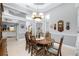 Elegant dining room featuring a wood table and chandelier at 848 Boundary Blvd, Rotonda West, FL 33947