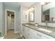 Double vanity bathroom with granite countertop at 156 Crevalle Rd, Rotonda West, FL 33947