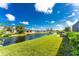 Stunning canal view from the backyard, showcasing serene waterfront property at 230 Long Meadow Ln, Rotonda West, FL 33947