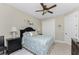 Bedroom with a ceiling fan and built-in closet at 230 Long Meadow Ln, Rotonda West, FL 33947