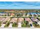 Aerial view of a home with a driveway and landscaping at 3390 Osprey Ln, Port Charlotte, FL 33953