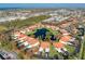 Aerial view of a condo unit with parking and a view of the lake at 404 Pine Hollow Cir # 404, Englewood, FL 34223
