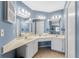 Double vanity bathroom with updated light fixtures at 404 Pine Hollow Cir # 404, Englewood, FL 34223