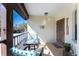 Inviting balcony with patio furniture and view of tropical landscaping at 404 Pine Hollow Cir # 404, Englewood, FL 34223