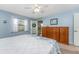 King bedroom with ceiling fan and access to balcony at 404 Pine Hollow Cir # 404, Englewood, FL 34223