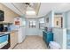 Bright kitchen with light wood cabinets and modern appliances at 404 Pine Hollow Cir # 404, Englewood, FL 34223