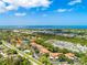 Aerial view of the community, including a lake, buildings, and surrounding area at 404 Pine Hollow Cir # 404, Englewood, FL 34223