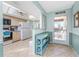 Bright kitchen with light wood cabinets and modern appliances at 404 Pine Hollow Cir # 404, Englewood, FL 34223