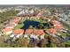Aerial view highlighting a specific condo unit near a lake at 404 Pine Hollow Cir # 404, Englewood, FL 34223
