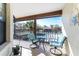 Private balcony with seating area and scenic views at 404 Pine Hollow Cir # 404, Englewood, FL 34223