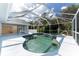 Inviting screened pool and spa with plenty of space for relaxation at 110 Abercrombie Ave, Englewood, FL 34223