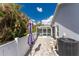 Relaxing patio area with pavers and privacy fence at 110 Abercrombie Ave, Englewood, FL 34223