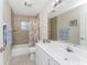 Bathroom with tub and shower combo at 110 Abercrombie Ave, Englewood, FL 34223
